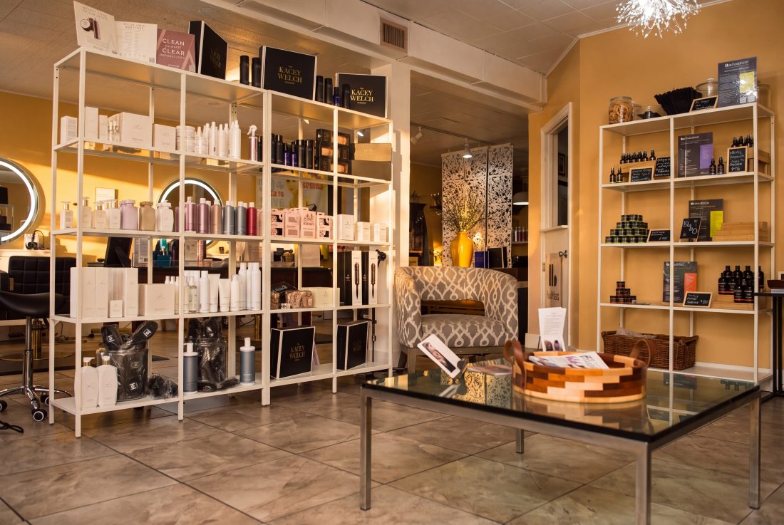 The retail wall and lounge inside Brittany's Hair